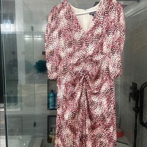 It is silk and gathered
 around the sleeves and the waist